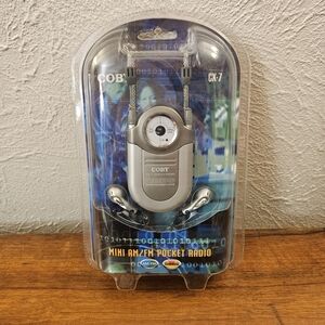 Coby Mini AM/FM DBBS CX-7 Pocket Radio With Earphones & Neck Strap New